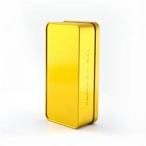 Négyszögletű aranyszínű fémtetős teásdoboz