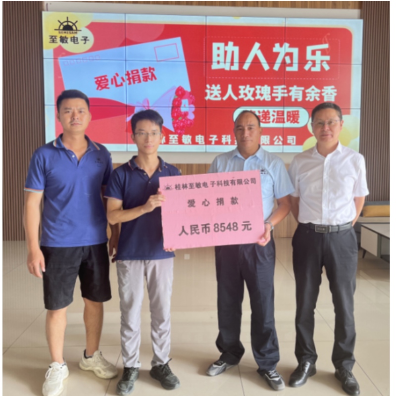 A Guilin Semisam Electronic Technology Co., Ltd. alkalmazottja egyesíti, hogy meleg reményt építsen Jiang számára.